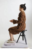    Aera  1 brown dots dress casual dressed sitting white oxford shoes whole body 0009.jpg